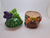 Ceramic toadstool house pot with purple butterfly and lid.