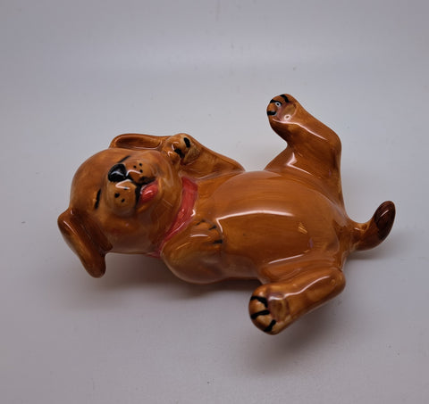 Brown laying ceramic dog
